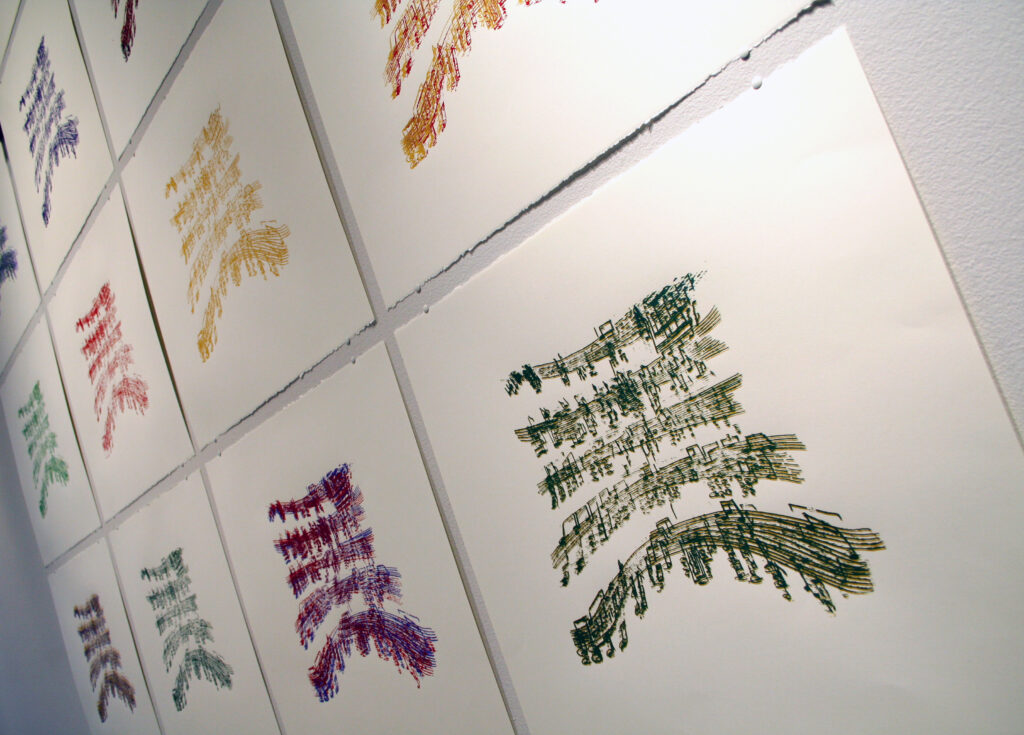 four bars of music notation are distorted, created by the sound waves from a remote control device